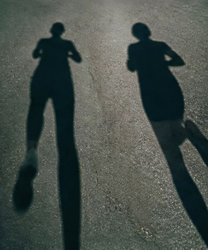 Two people’s shadows on a shared canvas, with teammates’ cursors labelled Jasmine, Jean-Denis, and Ryan.