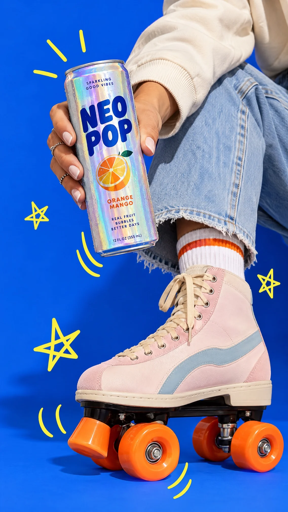 A Neo Pop can beside roller skates on blue