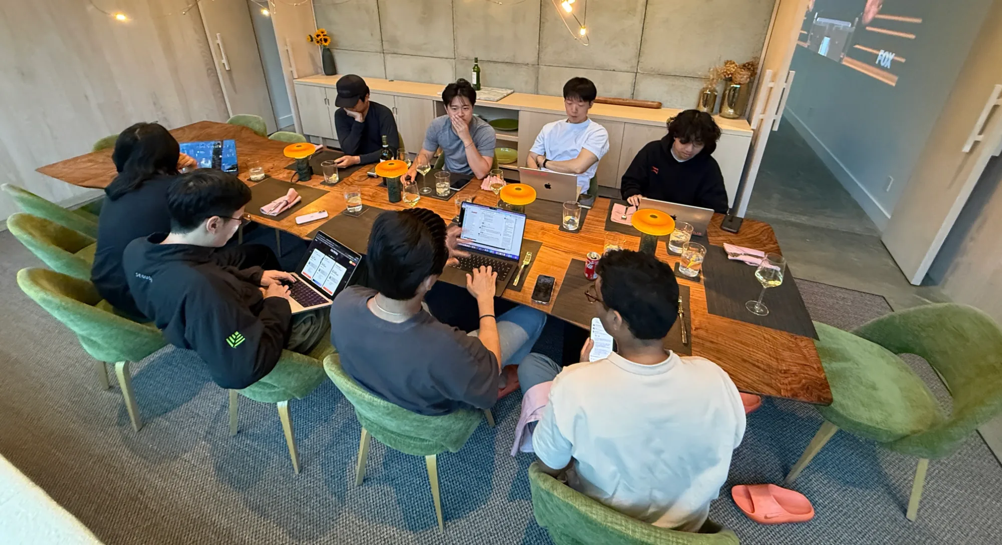 The team working on the app pre-launch during dinner at the offsite