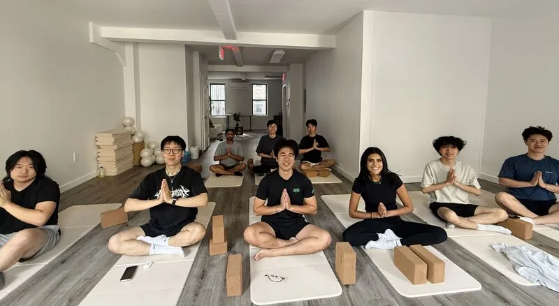 The Melius team doing yoga at 8am in the morning